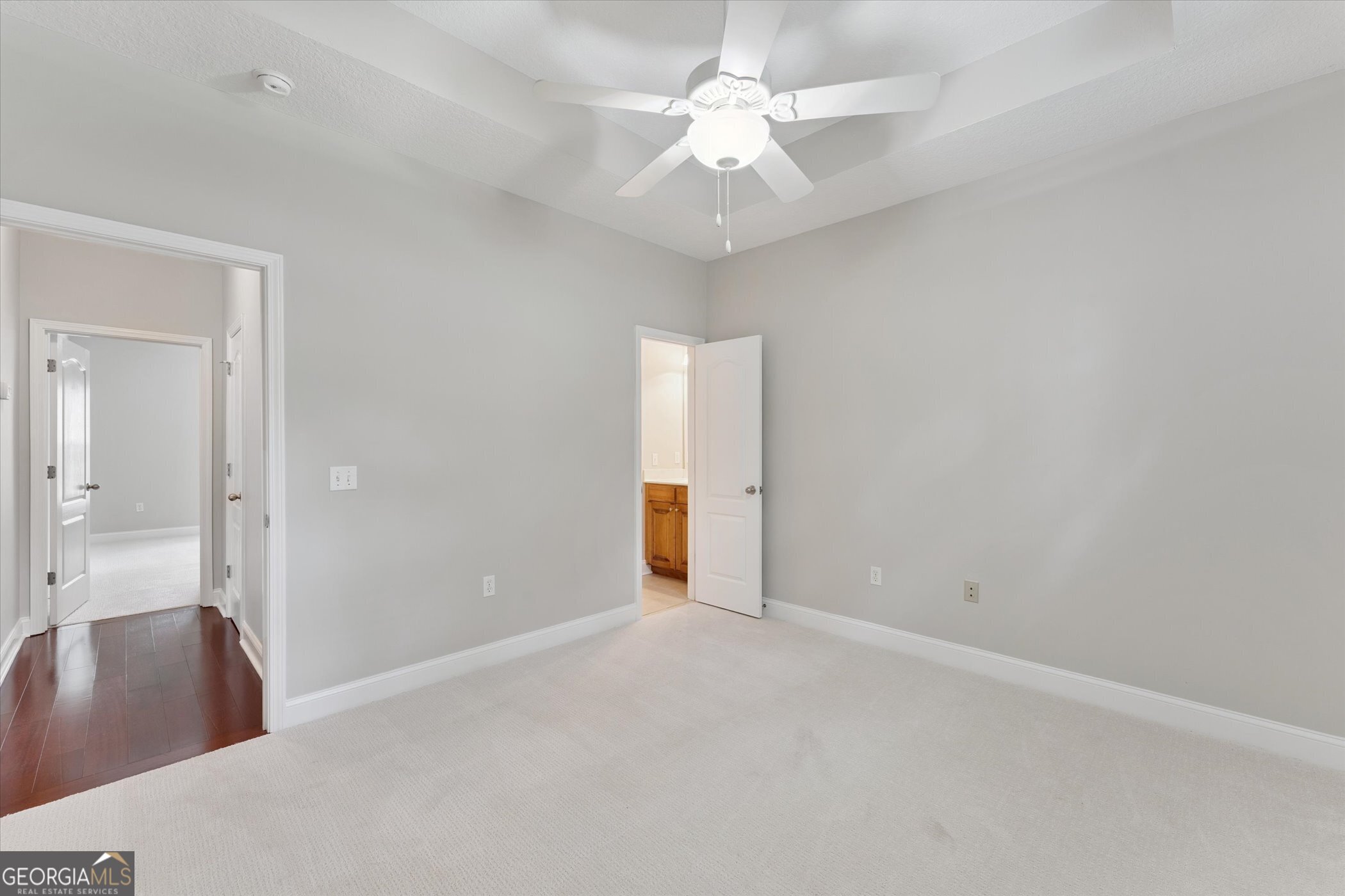 45 Veranda Trail Midway, GA 31320 - Photo 18 of 32 an empty room with fan and entrance