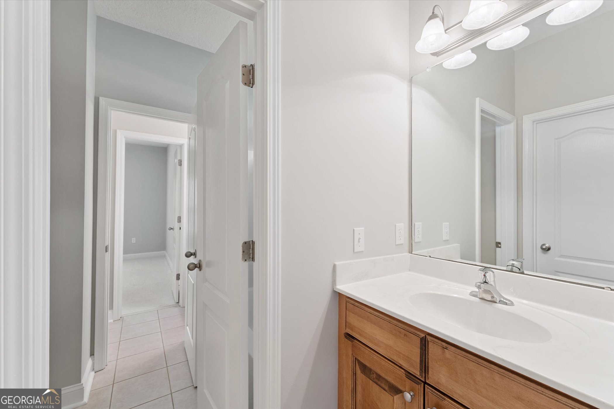 45 Veranda Trail Midway, GA 31320 - Photo 19 of 32 a bathroom with a sink a vanity and a mirror
