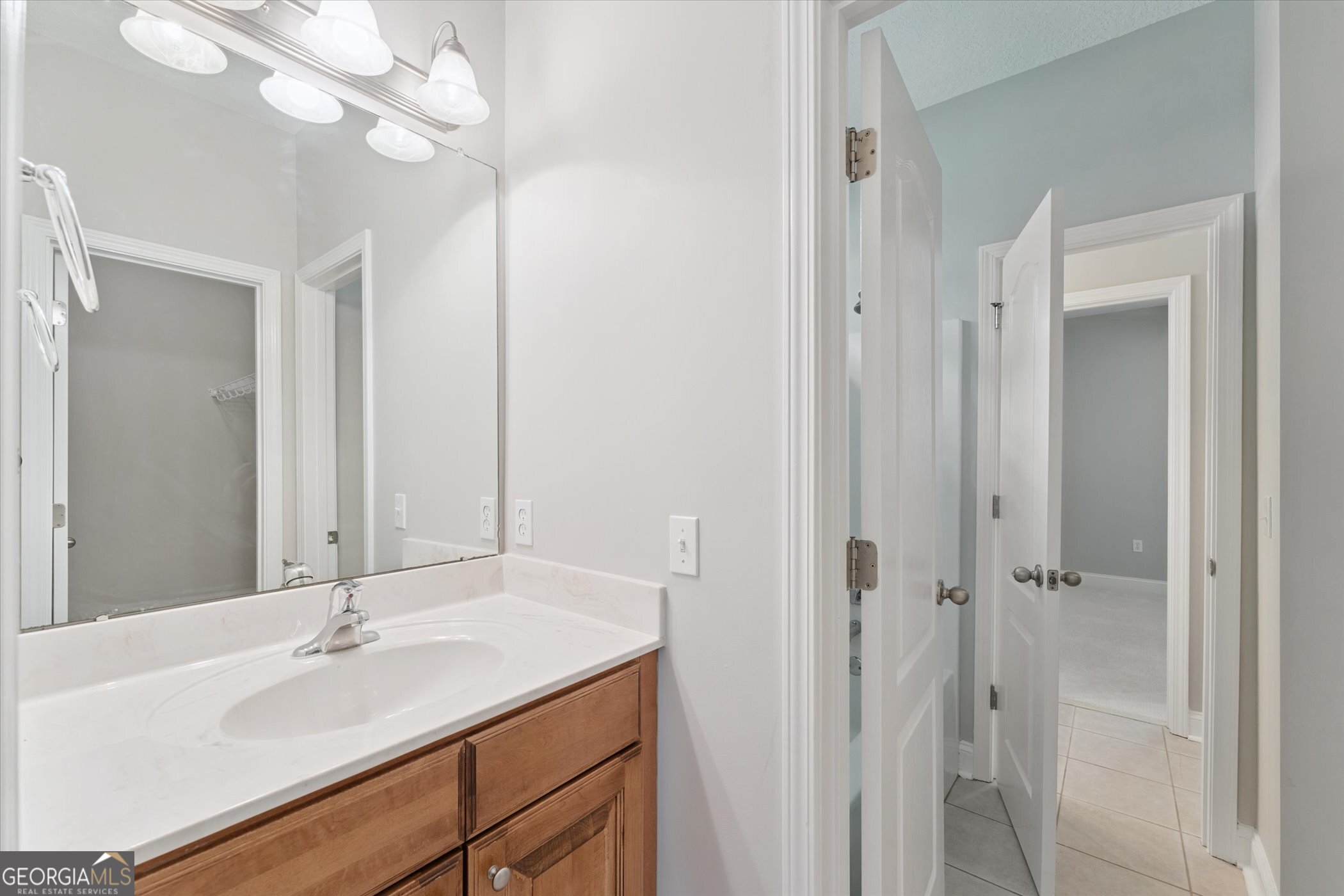 45 Veranda Trail Midway, GA 31320 - Photo 20 of 32 a bathroom with a sink a mirror and a shower