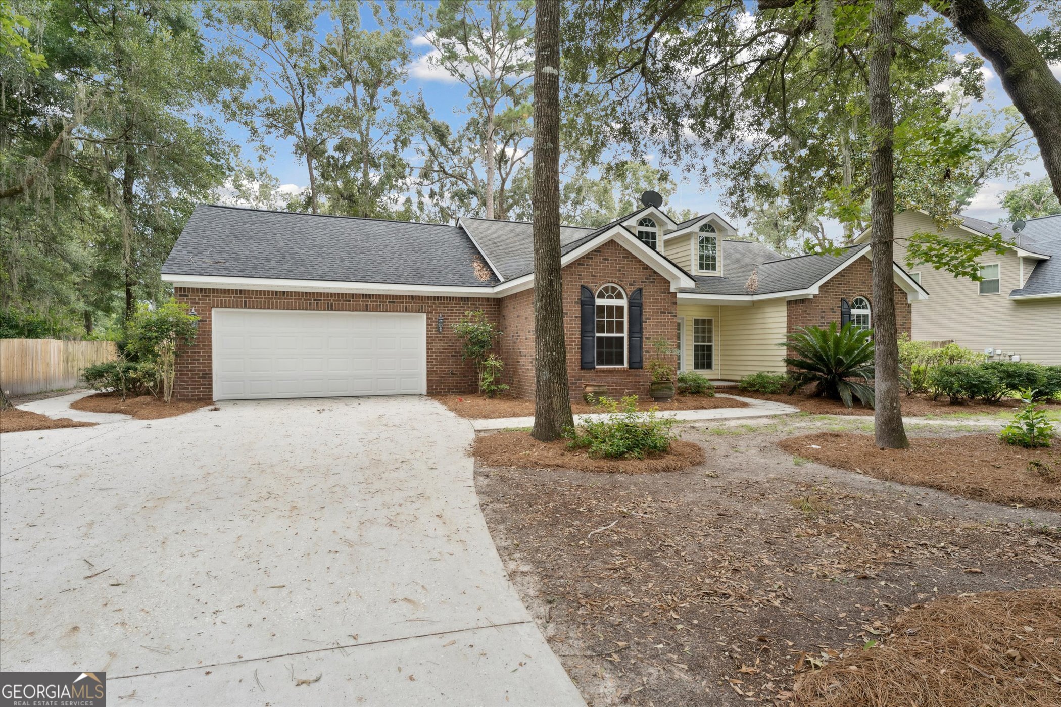 45 Veranda Trail Midway, GA 31320 - Photo 2 of 32 a front view of a house with a garden