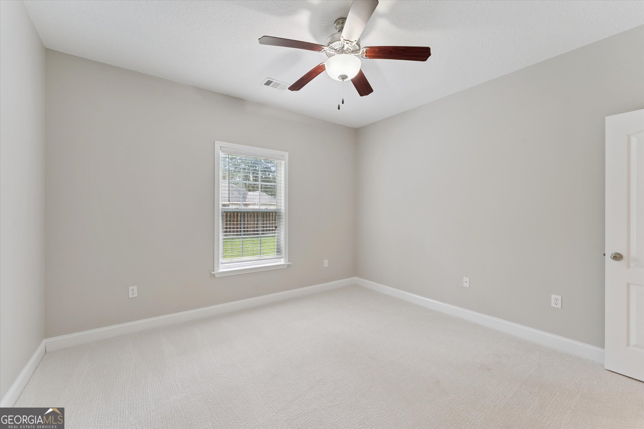 45 Veranda Trail Midway, GA 31320 - Photo 21 of 32 a view of an empty room with a window