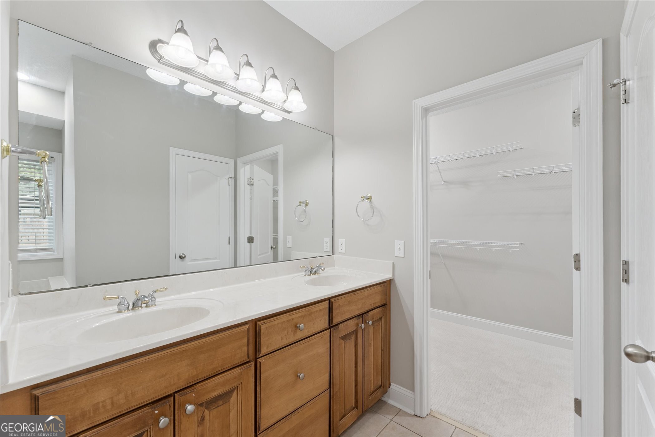 45 Veranda Trail Midway, GA 31320 - Photo 28 of 32 a bathroom with a sink double vanity and a mirror