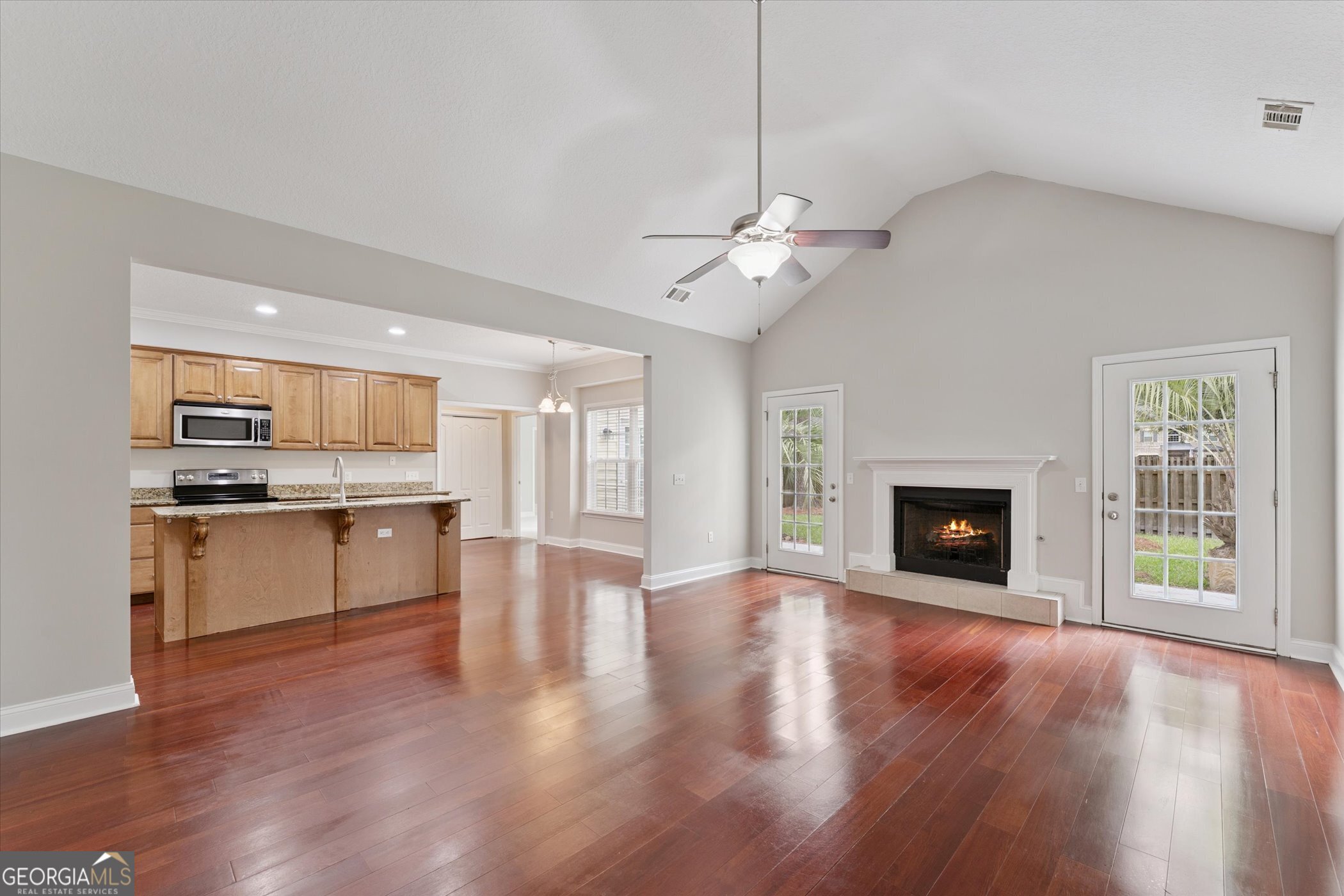 45 Veranda Trail Midway, GA 31320 - Photo 6 of 32 a view of a kitchen with a sink stove cabinets and empty room