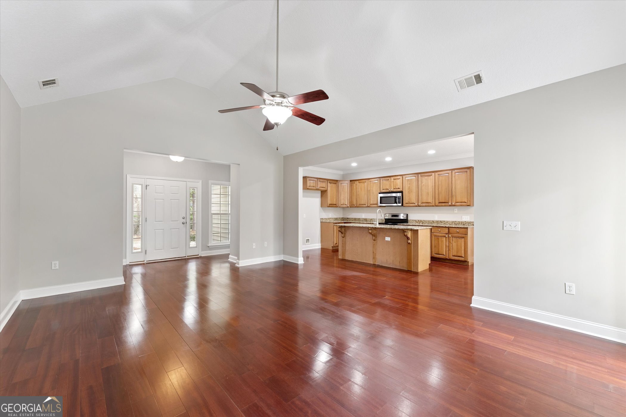 45 Veranda Trail Midway, GA 31320 - Photo 8 of 32 a view of an empty room with kitchen and window