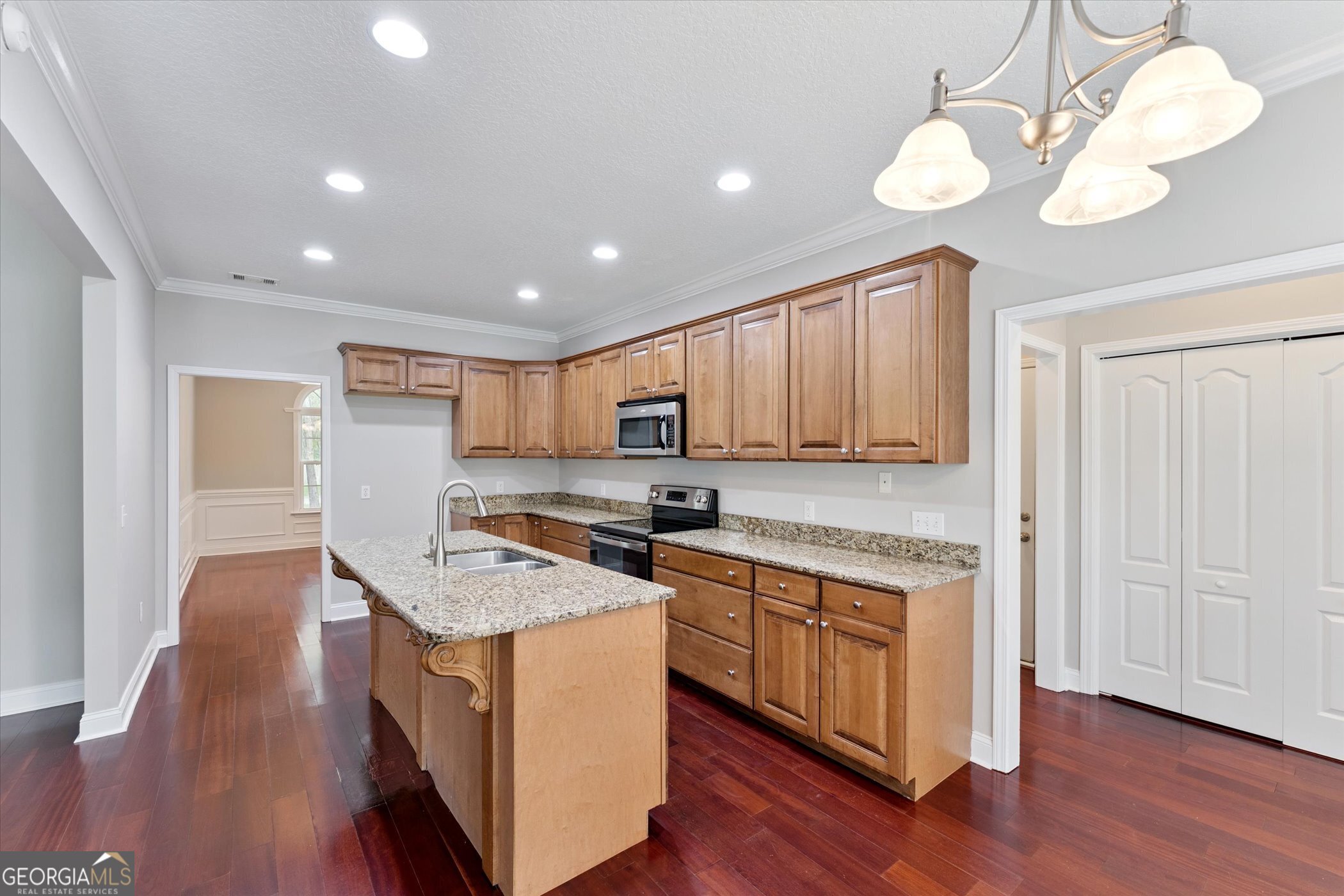 45 Veranda Trail Midway, GA 31320 - Photo 10 of 32 a open kitchen with wooden floor and stainless steel appliances