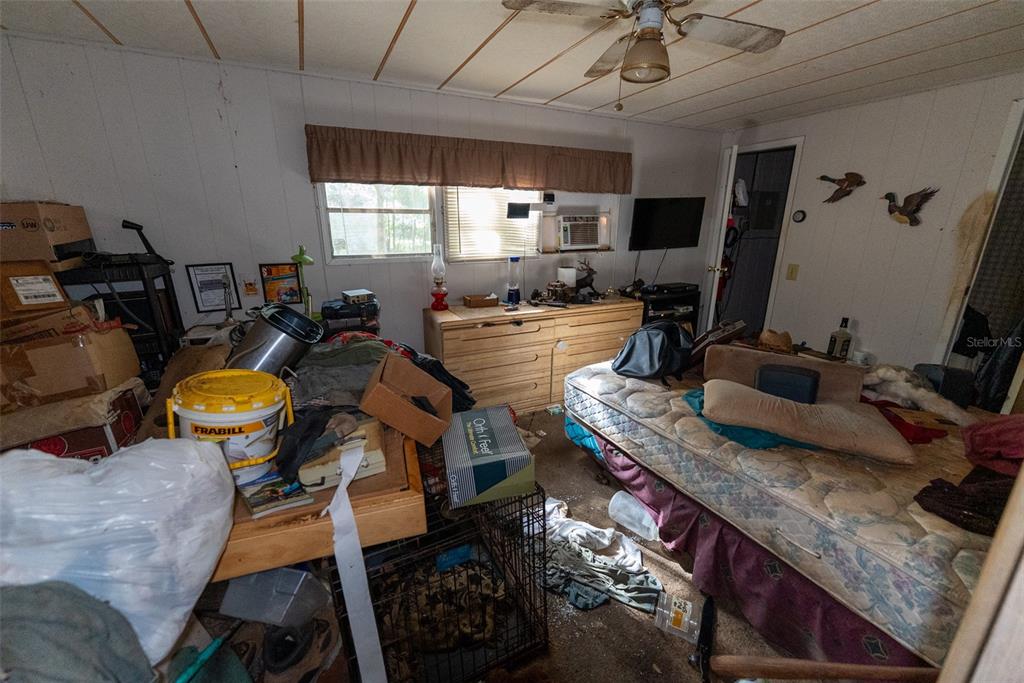 24971 Northeast 135th Street Salt Springs, FL 32134 - Photo 34 of 49 a view of a kitchen with kitchen island granite countertop furniture and a sink