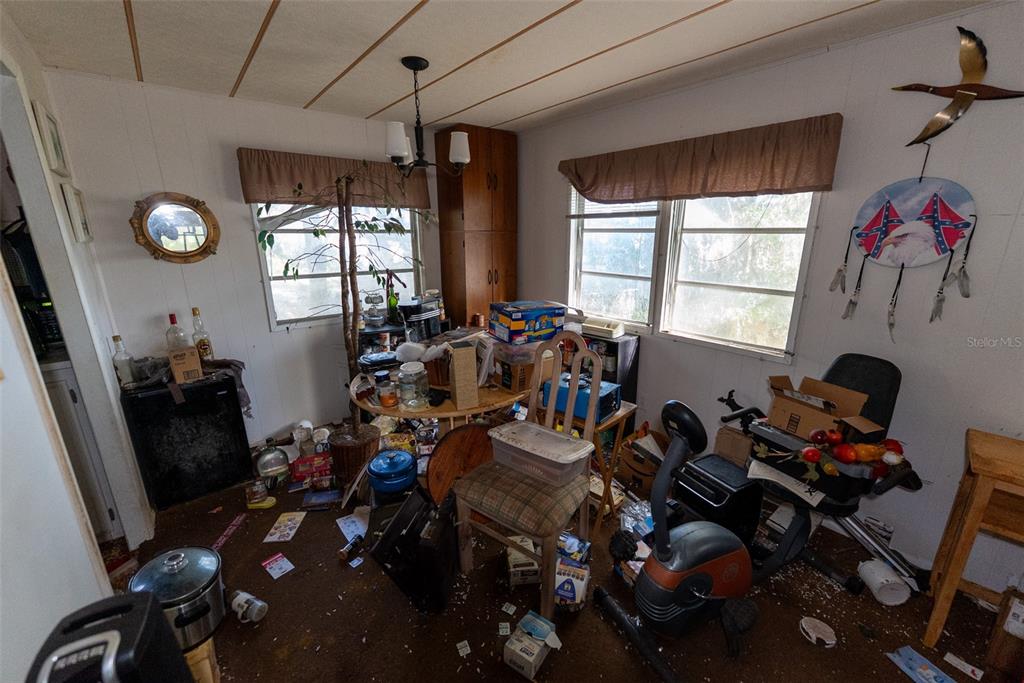 24971 Northeast 135th Street Salt Springs, FL 32134 - Photo 43 of 49 a room with gym equipment and a window