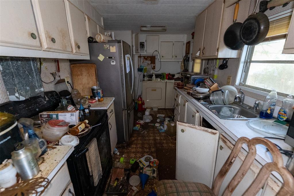 24971 Northeast 135th Street Salt Springs, FL 32134 - Photo 44 of 49 a kitchen with a sink appliances and cabinets