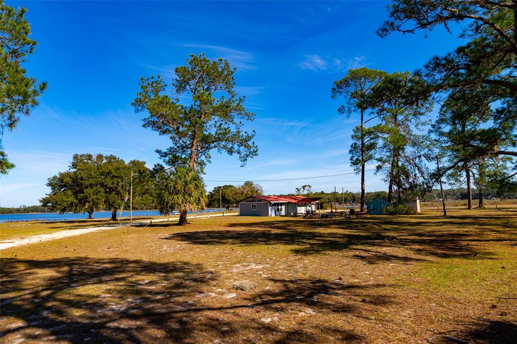 24971 Northeast 135th Street Salt Springs, FL 32134 - Photo 49 of 49 a view of a lake with houses
