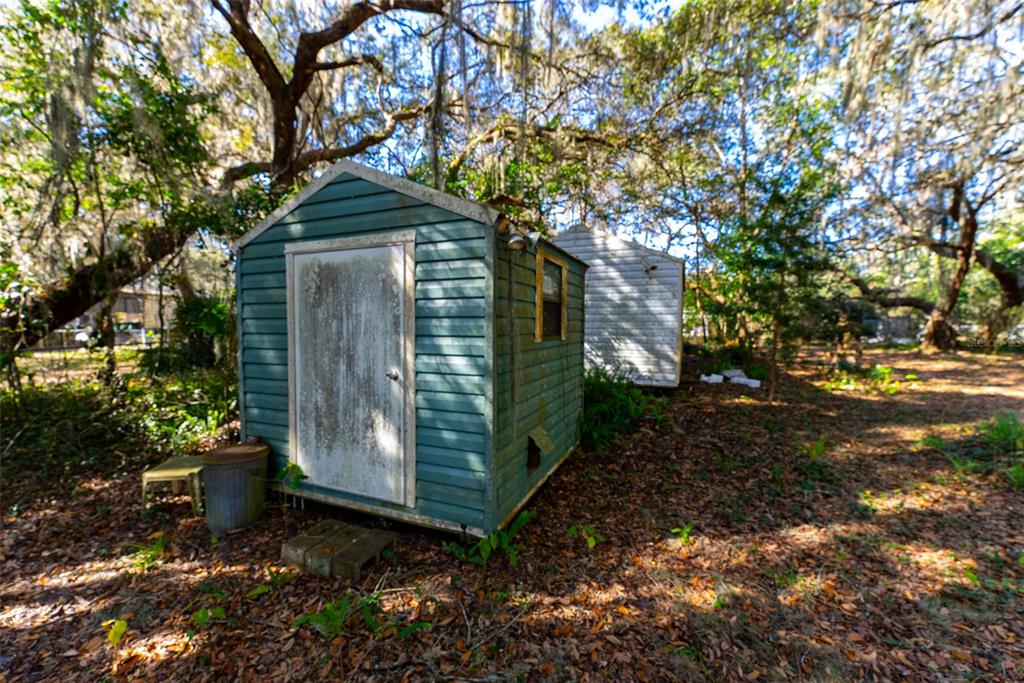 24971 Northeast 135th Street Salt Springs, FL 32134 - Photo 5 of 49 a yellow house with trees in front of it