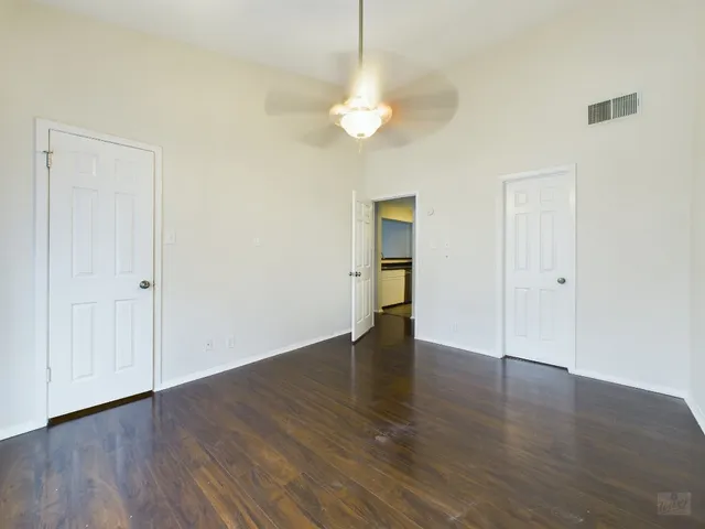 a view of livingroom with window wooden floor and front door
