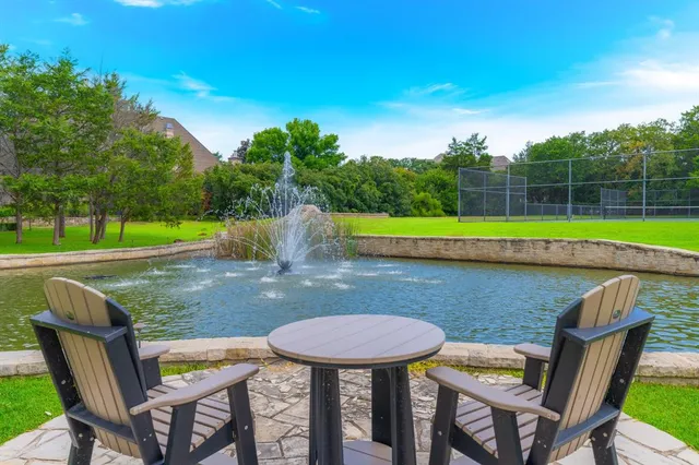 a living room with furniture fireplace and flat screen tv