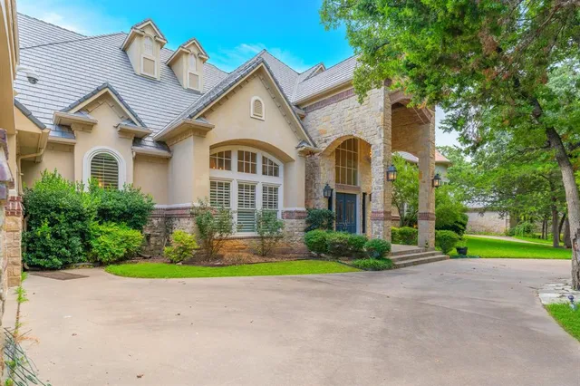 a view of a swimming pool with a yard