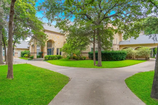 a swimming pool with outdoor seating and yard
