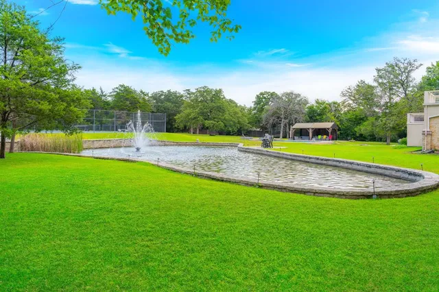 a view of a kitchen with a sink and garden