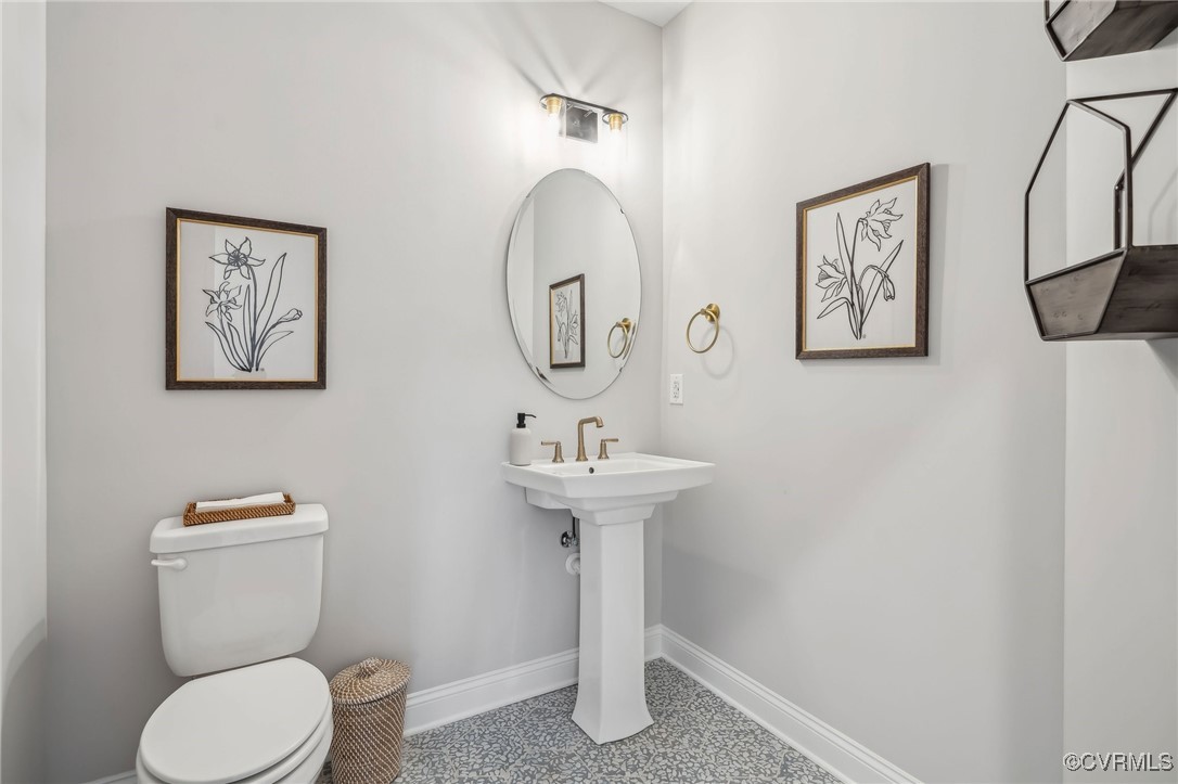 16873 Watchman Way Beaverdam, VA 23015 - Photo 13 of 40 a bathroom with a toilet sink and mirror
