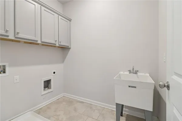 a bathroom with a sink and cabinets