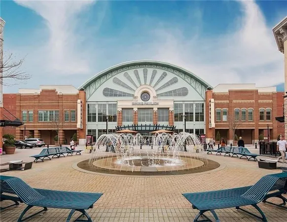 a view of a dining room with furniture and a large window