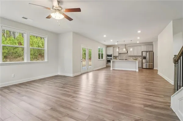 a view of kitchen with sink and wooden floor