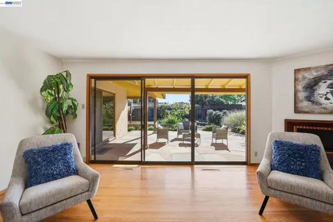 a kitchen with a sink appliances and cabinets