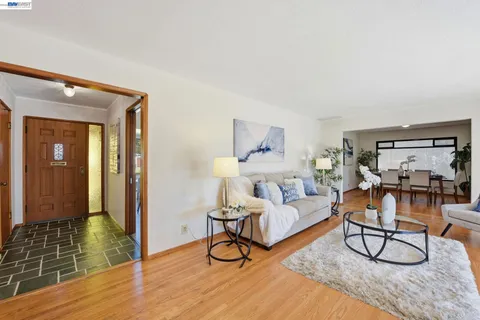 a living room with furniture and a rug