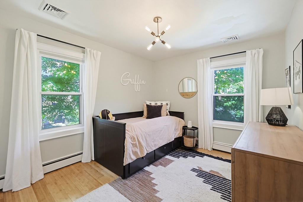 345 Sherman Street Canton, MA 02021 - Photo 28 of 42 a room with a bed and a window