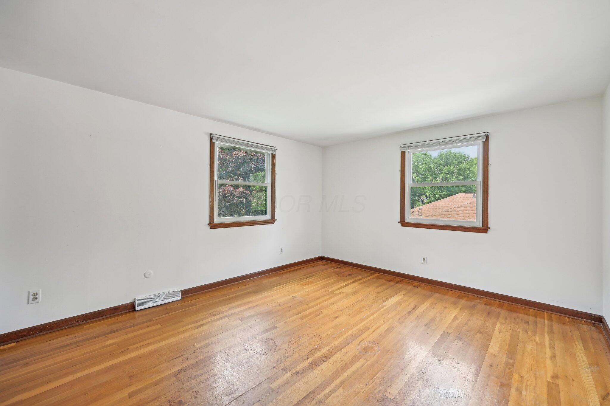 5917 Rocky Rill Road Columbus, OH 43235 - Photo 33 of 47 Bedroom 2
This spacious secondary bedroom features hardwood floors, two windows for natural light, and neutral walls—ready for personal touches.