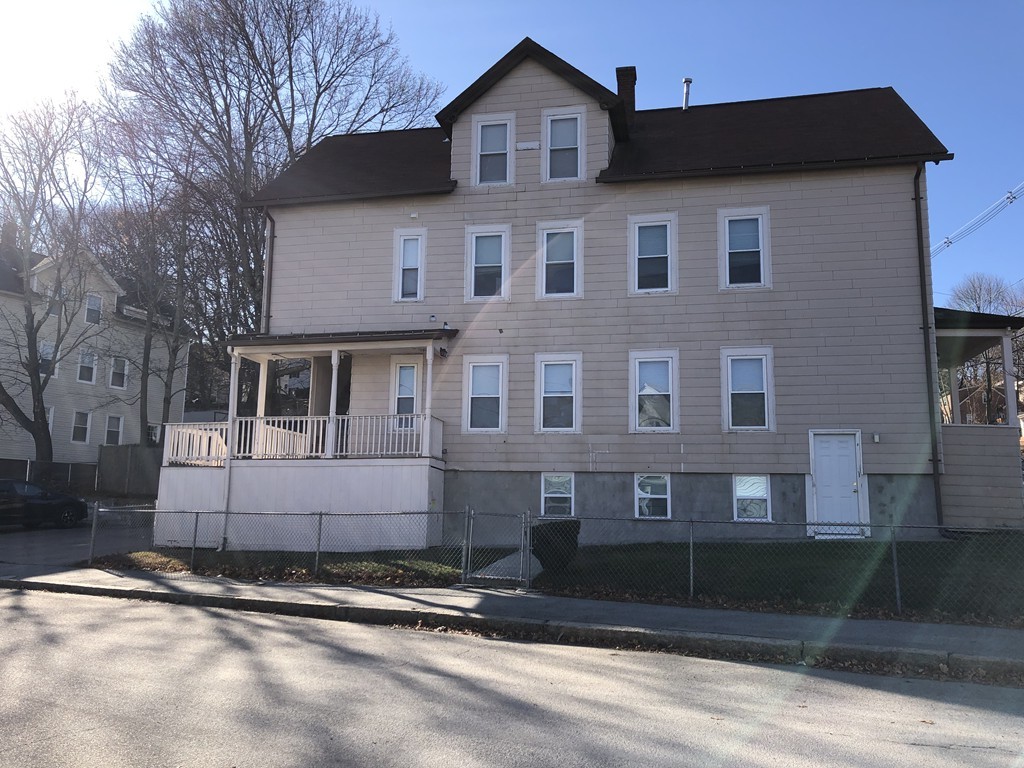 41 Whipple Street Worcester, MA 01607 - Photo 2 of 2 a front view of a house with a yard