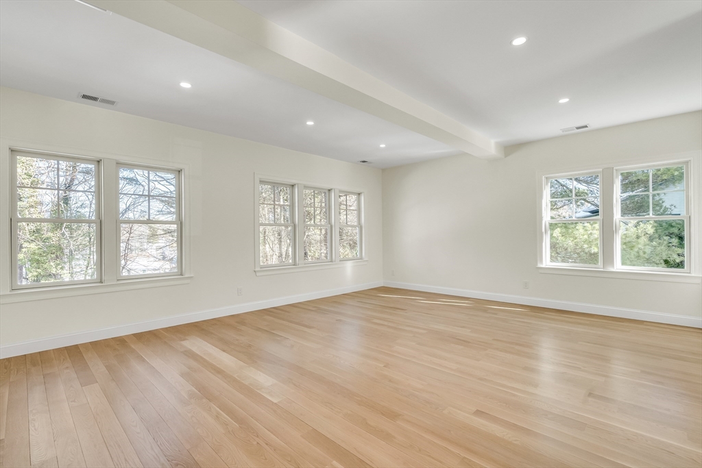 510 Common Street Walpole, MA 02081 - Photo 10 of 35 an empty room with wooden floor and windows