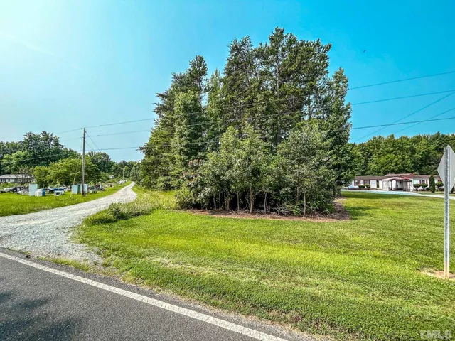 a view of a golf course with a lake view