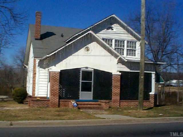 1522 Durham Road Roxboro, NC 27573 - Photo 1 of 2 a front view of a house with garage