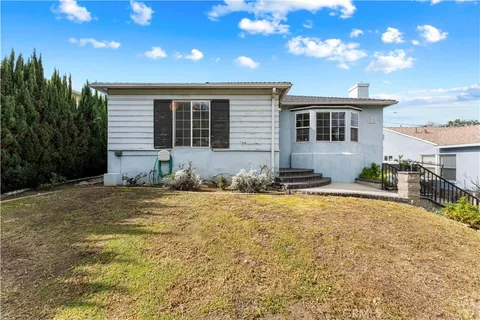a house view with a backyard space