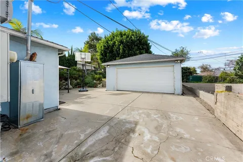 a view of backyard space and tree
