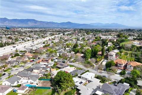 a view of a city with mountains in the background