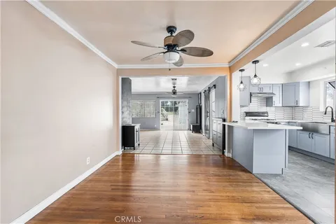 a view of kitchen with cabinets and wooden floor