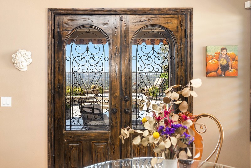 6962 Magdalena Drive Orange, CA 92867 - Photo 11 of 23 a view of front door with wooden floor