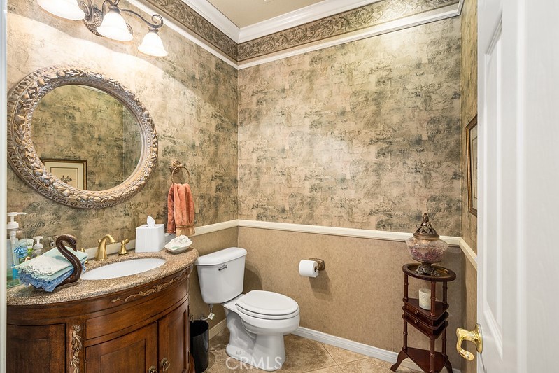 6962 Magdalena Drive Orange, CA 92867 - Photo 15 of 23 a bathroom with a sink a toilet and a mirror