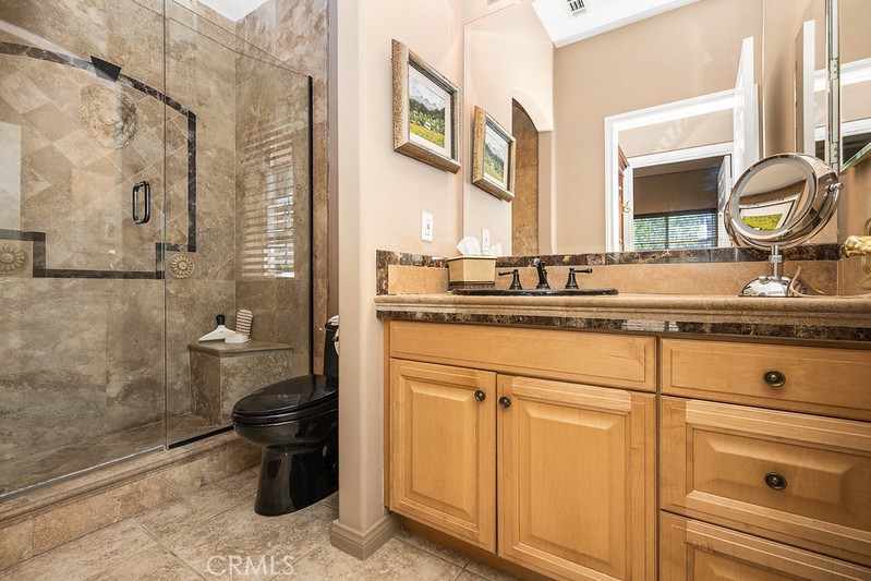 6962 Magdalena Drive Orange, CA 92867 - Photo 16 of 23 a bathroom with a sink and a mirror