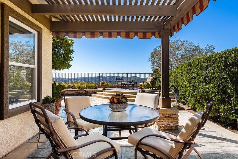 6962 Magdalena Drive Orange, CA 92867 - Photo 19 of 23 a view of a balcony with table and chairs