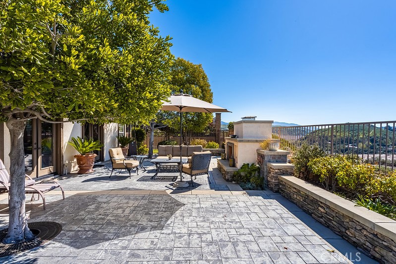 6962 Magdalena Drive Orange, CA 92867 - Photo 21 of 23 a view of a patio with chairs and a small yard
