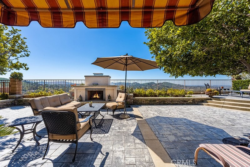 6962 Magdalena Drive Orange, CA 92867 - Photo 22 of 23 a view of a terrace with furniture and umbrella