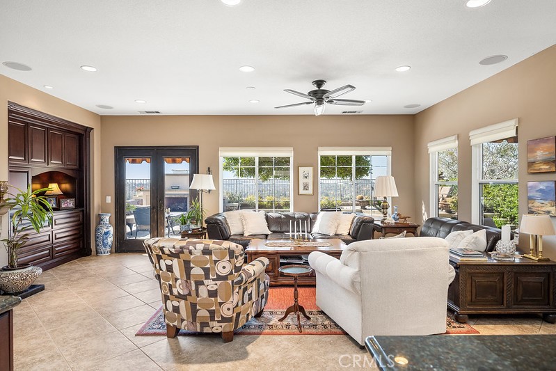 6962 Magdalena Drive Orange, CA 92867 - Photo 6 of 23 a living room with furniture large window and flat screen tv