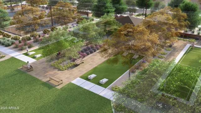 an aerial view of residential houses with outdoor space and trees