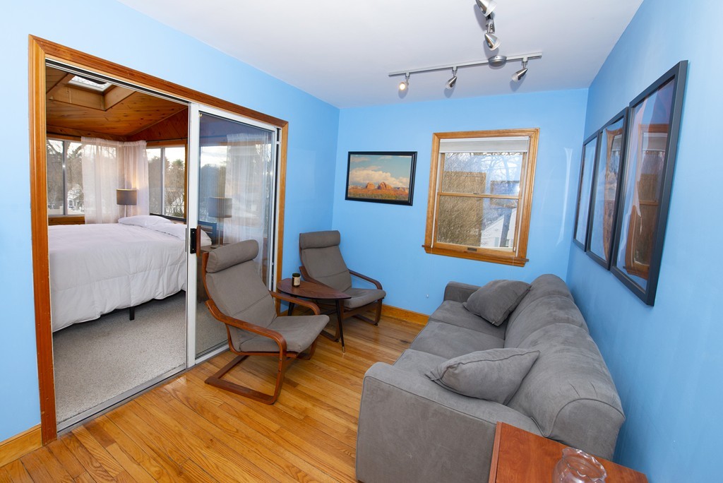 63 Pine Street Natick, MA 01760 - Photo 11 of 19 a living room with furniture a rug and a window