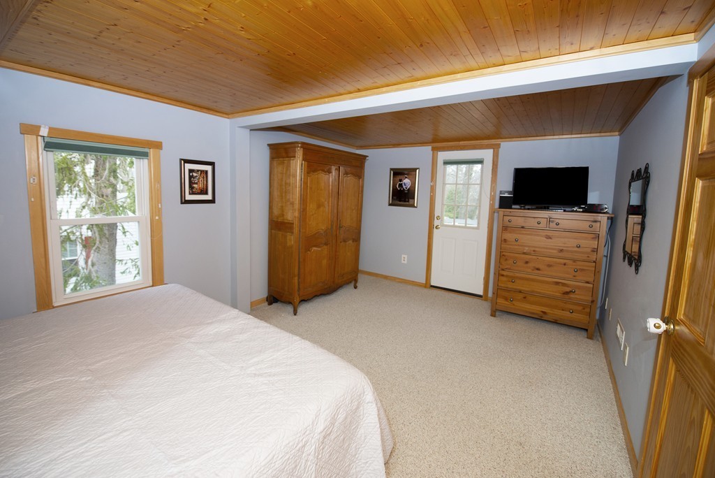 63 Pine Street Natick, MA 01760 - Photo 14 of 19 a bed room with a bed and a window