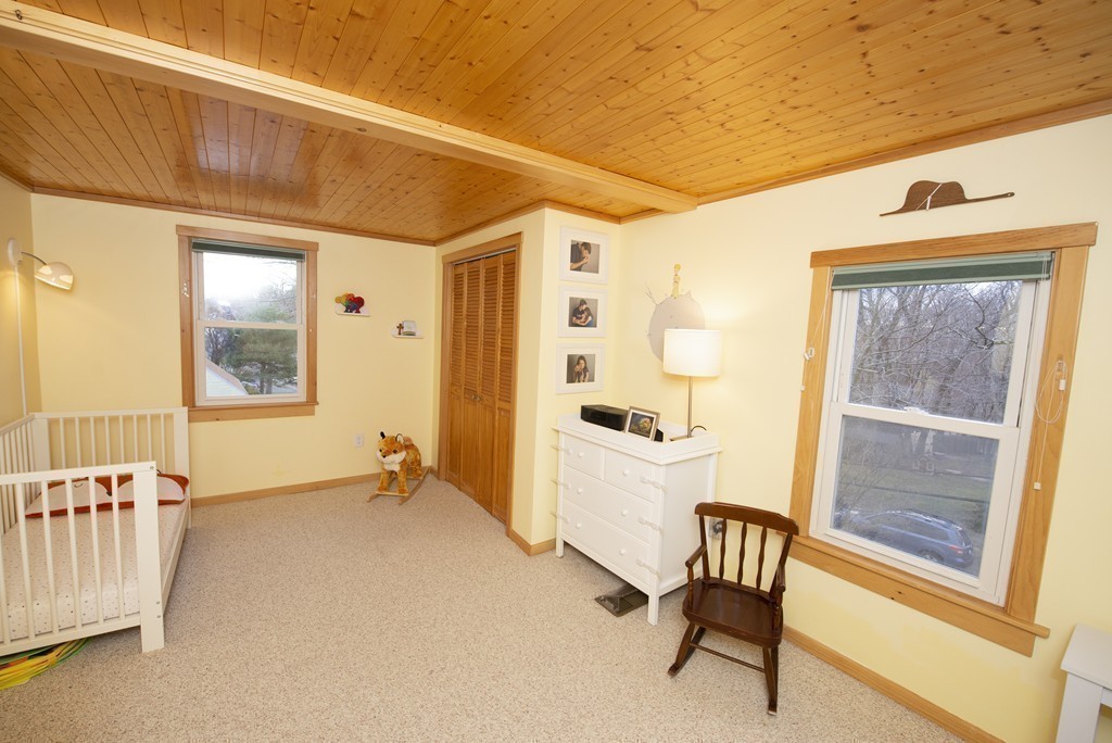 63 Pine Street Natick, MA 01760 - Photo 15 of 19 a view of a room with furniture and windows