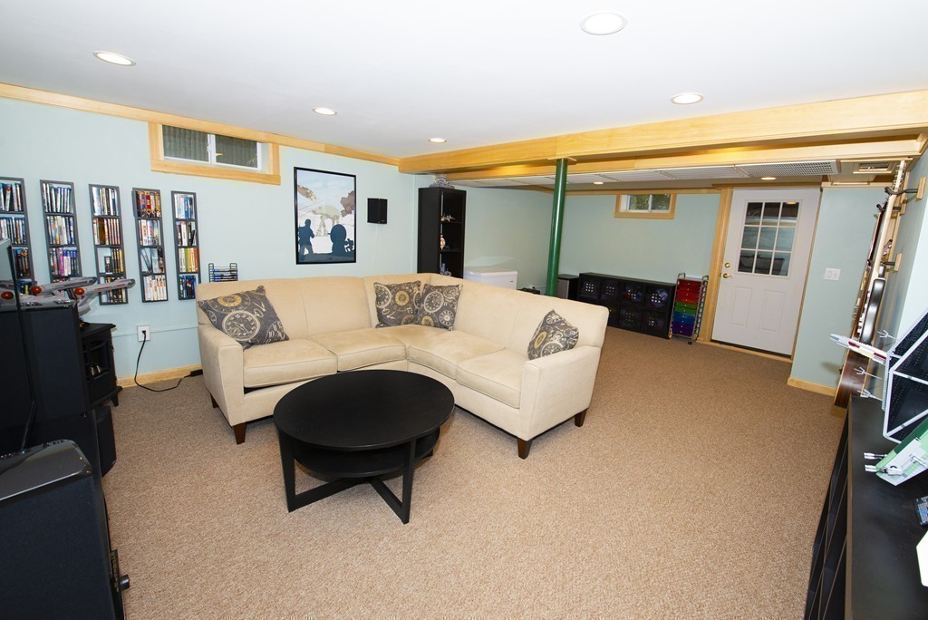 63 Pine Street Natick, MA 01760 - Photo 18 of 19 a living room with furniture and a flat screen tv