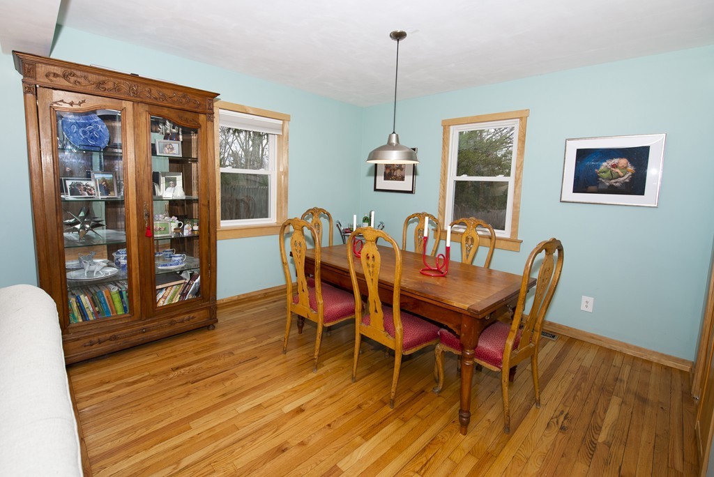 63 Pine Street Natick, MA 01760 - Photo 8 of 19 a view of a dining room with furniture and wooden floor