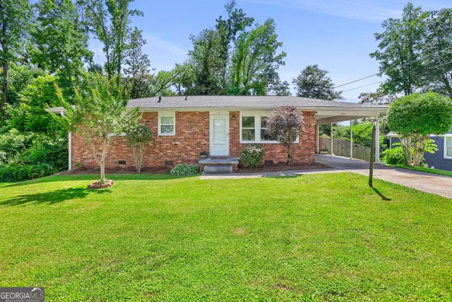 front view of a house with a yard
