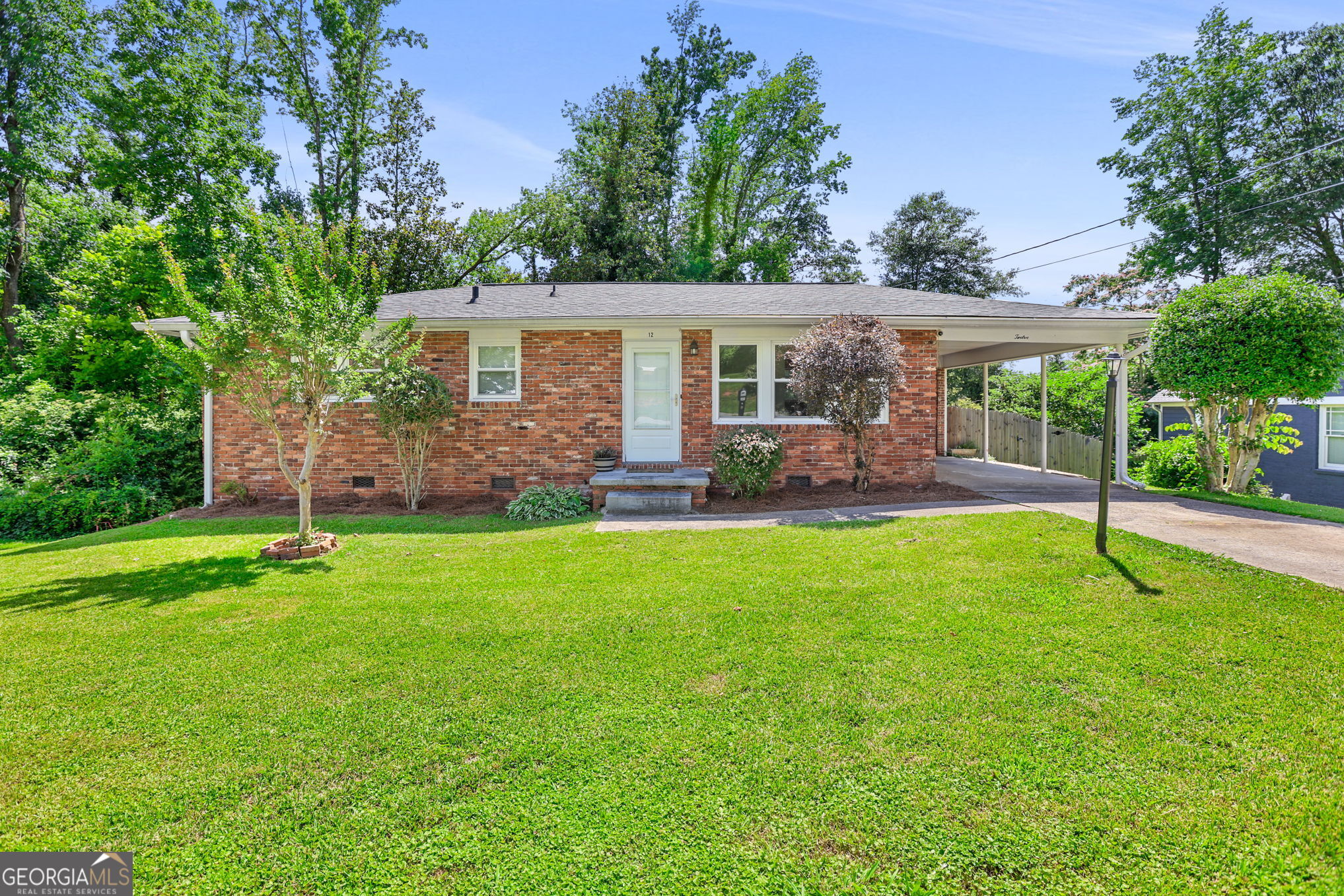 front view of a house with a yard